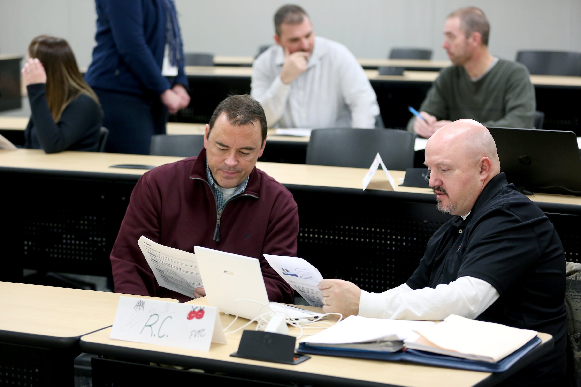 Students John Sobota (left) and R.C. Schroeder discuss topics during their Issues in Career and Technical Education class (CTE-708) in Jarvis Hall Friday, November 10, 2017. (UW-Stout photo by Brett T. Roseman)