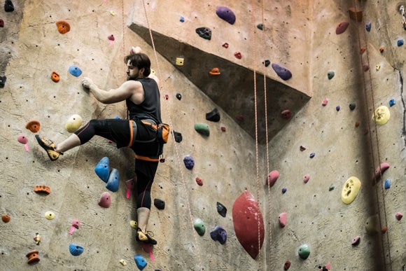 A UW-Stout student goes up the Stout Adventures climbing wall.