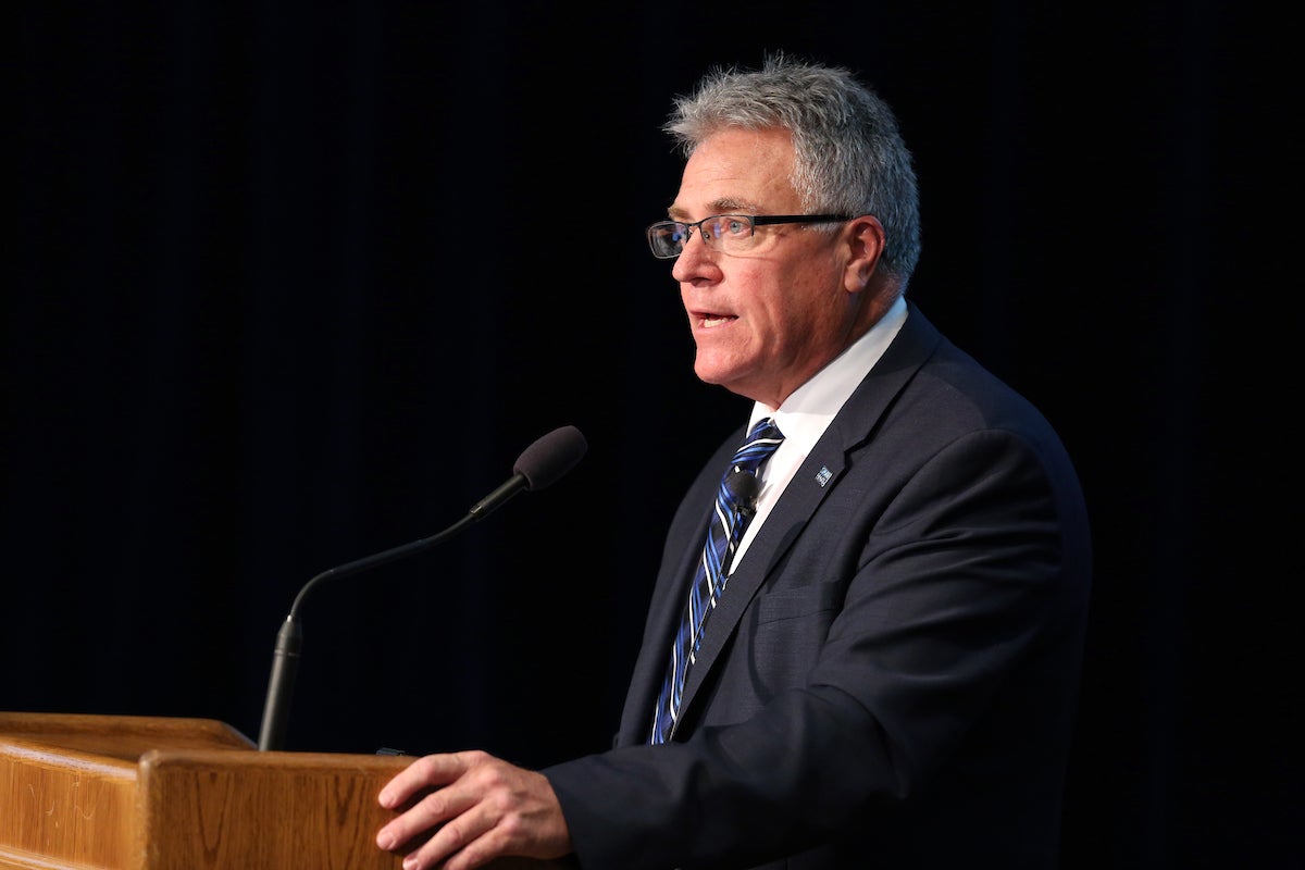 Chancellor Bob Meyer presents during a board meeting.