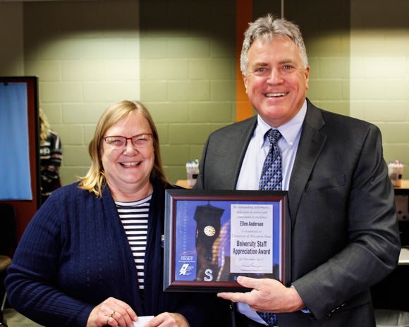 Ellen Anderson receives the University Staff Employee Appreciation Award for December from Chancellor Bob Meyer.