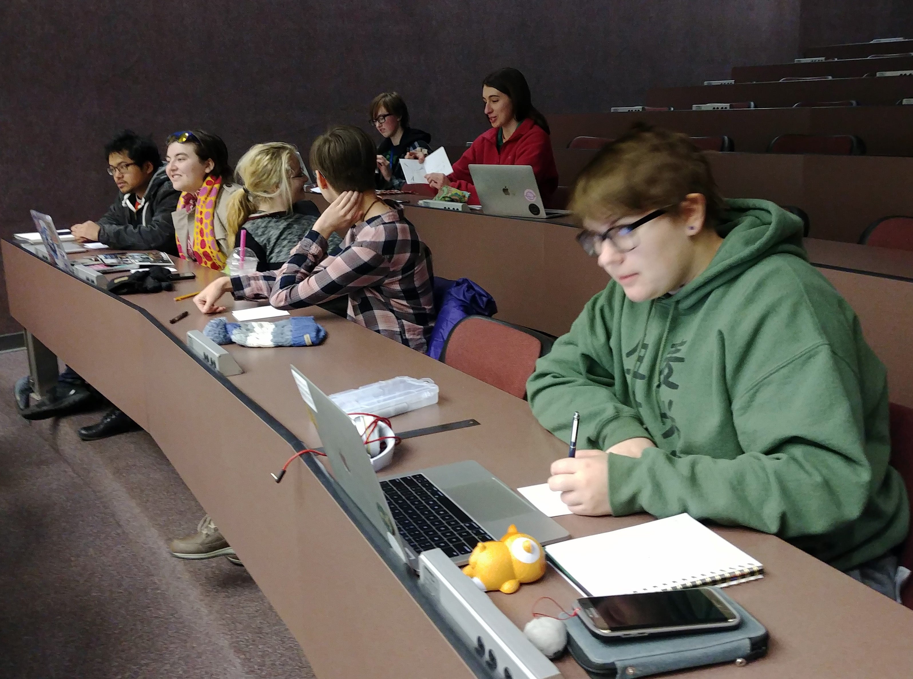 Comic Creators club members work on their valentines fundraiser.