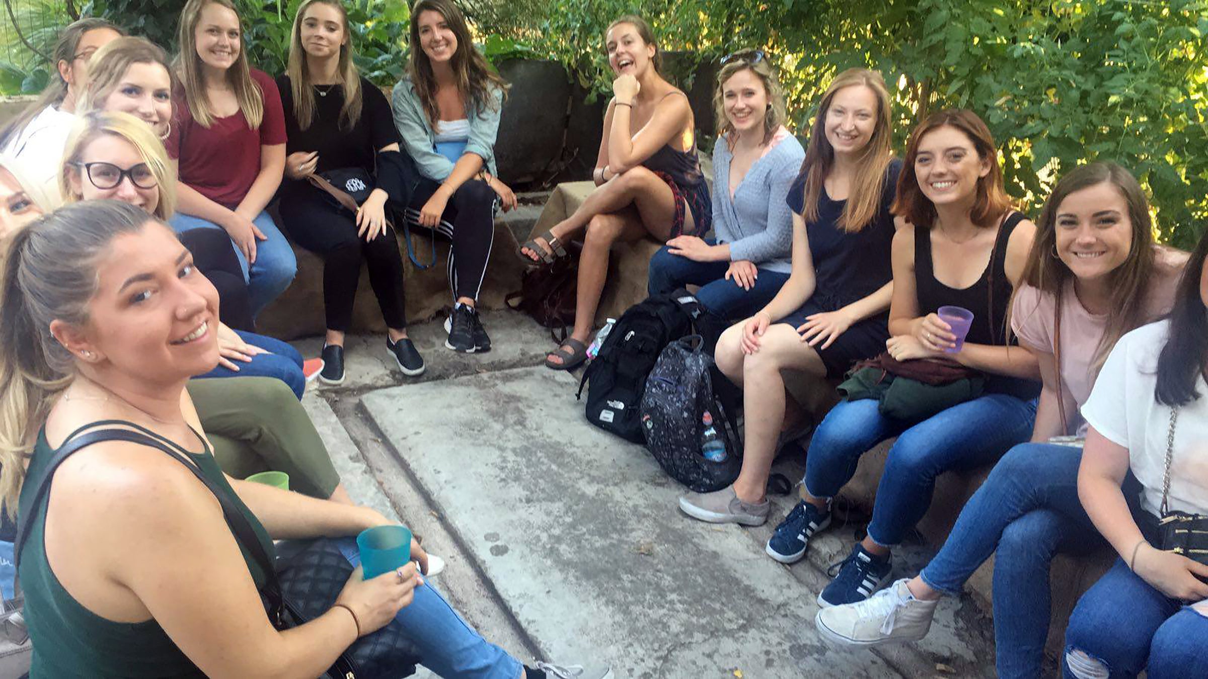 Samantha Bibbs, back left in red shirt, gives a presentation in Florence, Italy, to students about Funghi Espresso.