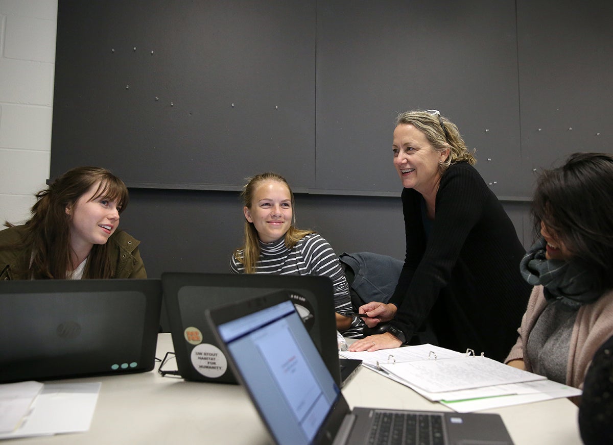 UW-Stout Professor Maureen Mitton, director of the Interior design Bachelor of Fine Arts program, talks with students during a recent interior design class. Mitton has been named a Most Admired Educator by Design Intelligence./ UW-Stout photo by Brett T. Roseman