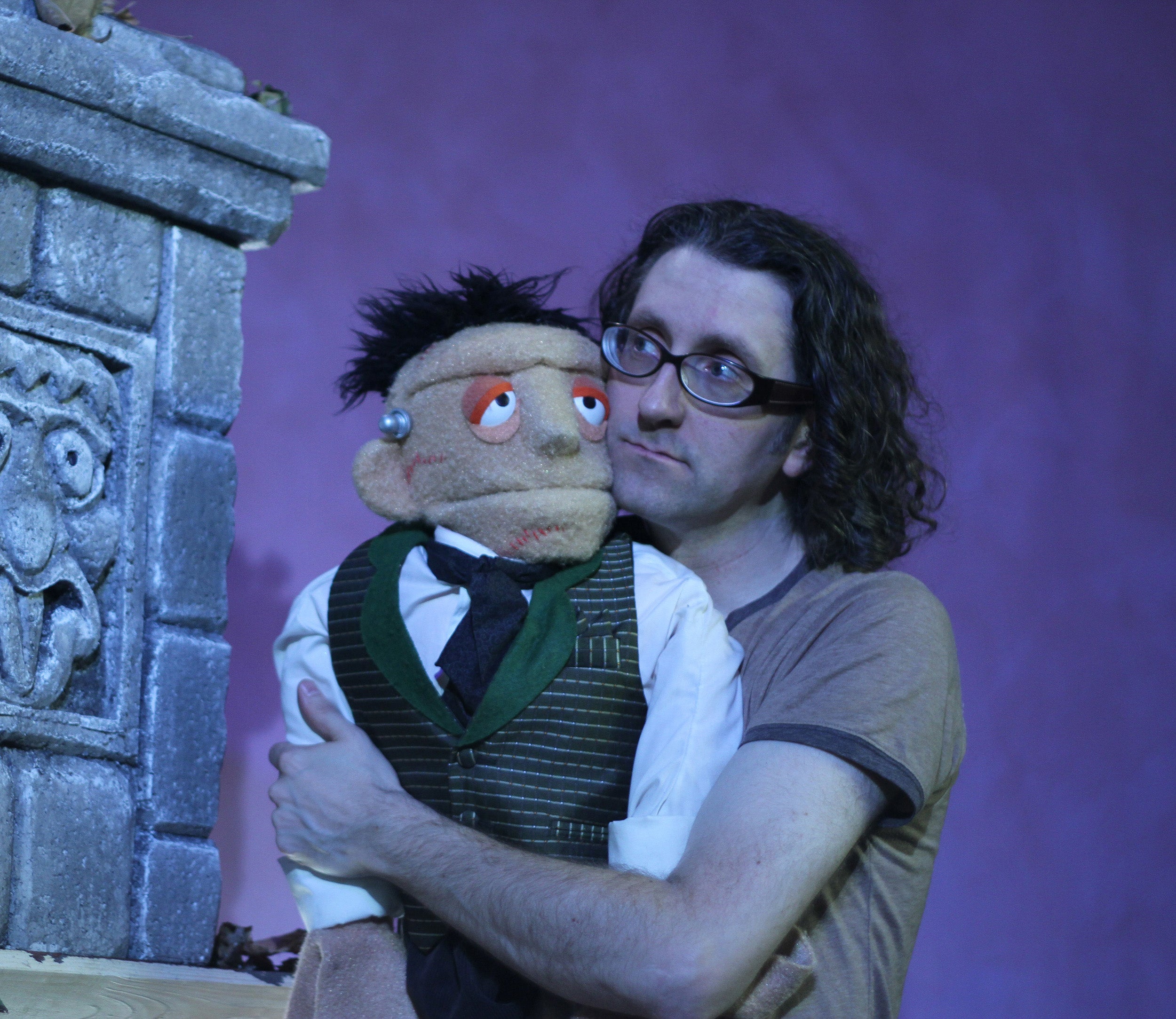 UW-Stout assistant professor Michael Heagle poses with the puppet, Dwayne Frankenstein, that he brings to life for “Transylvania Television.” Heagle co-created, writes and directs the show.