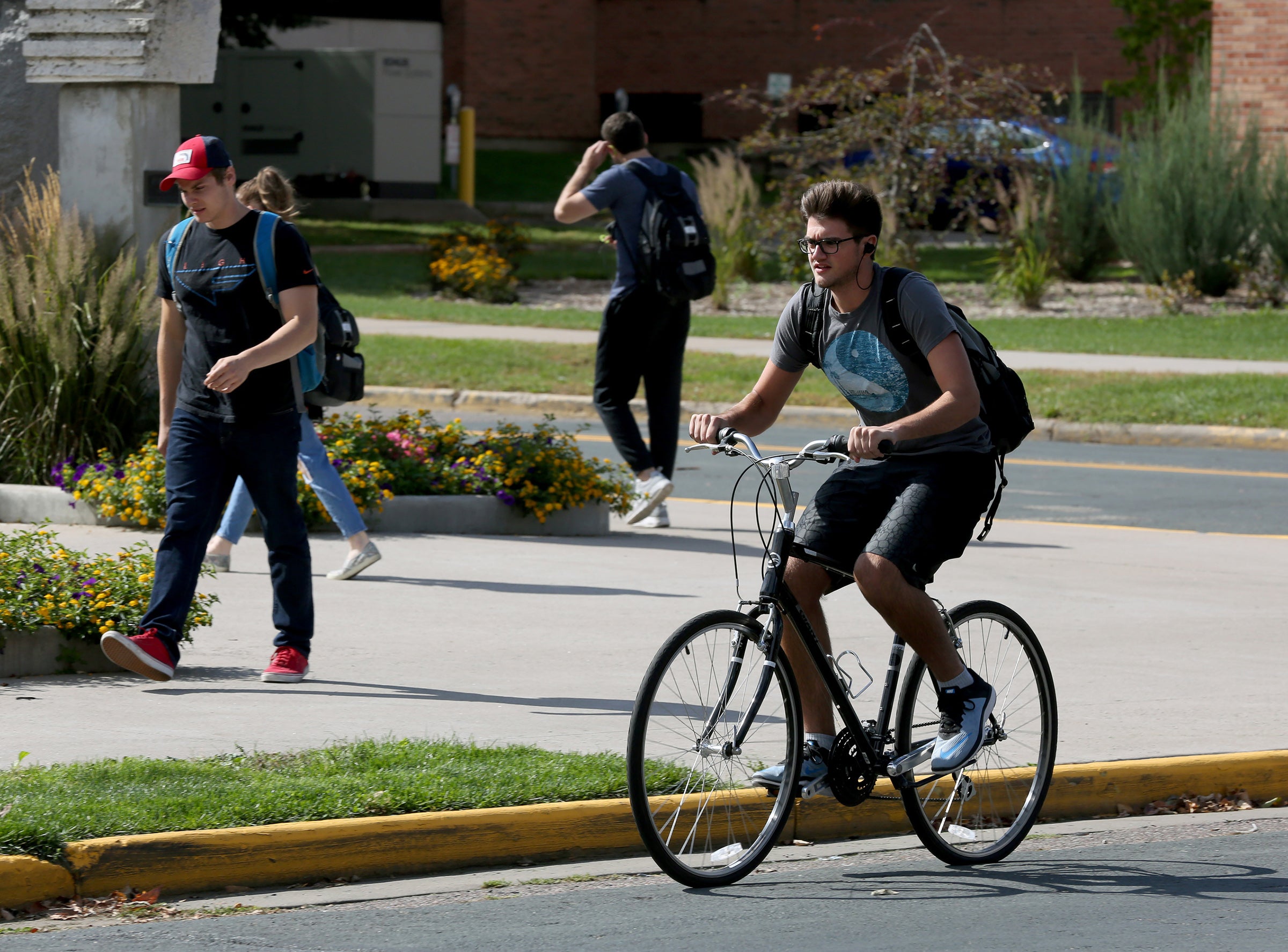 Biker A student bikes through campus recently.