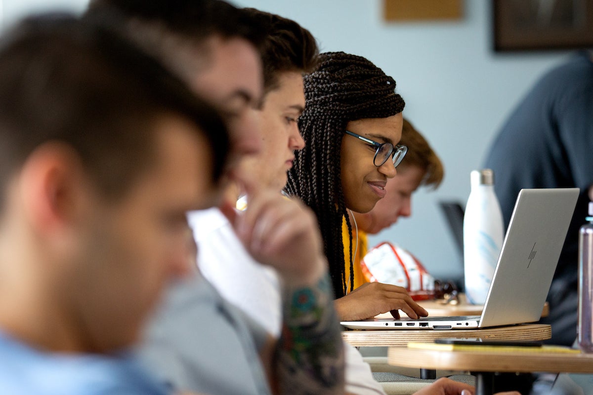 A group of students attend a session