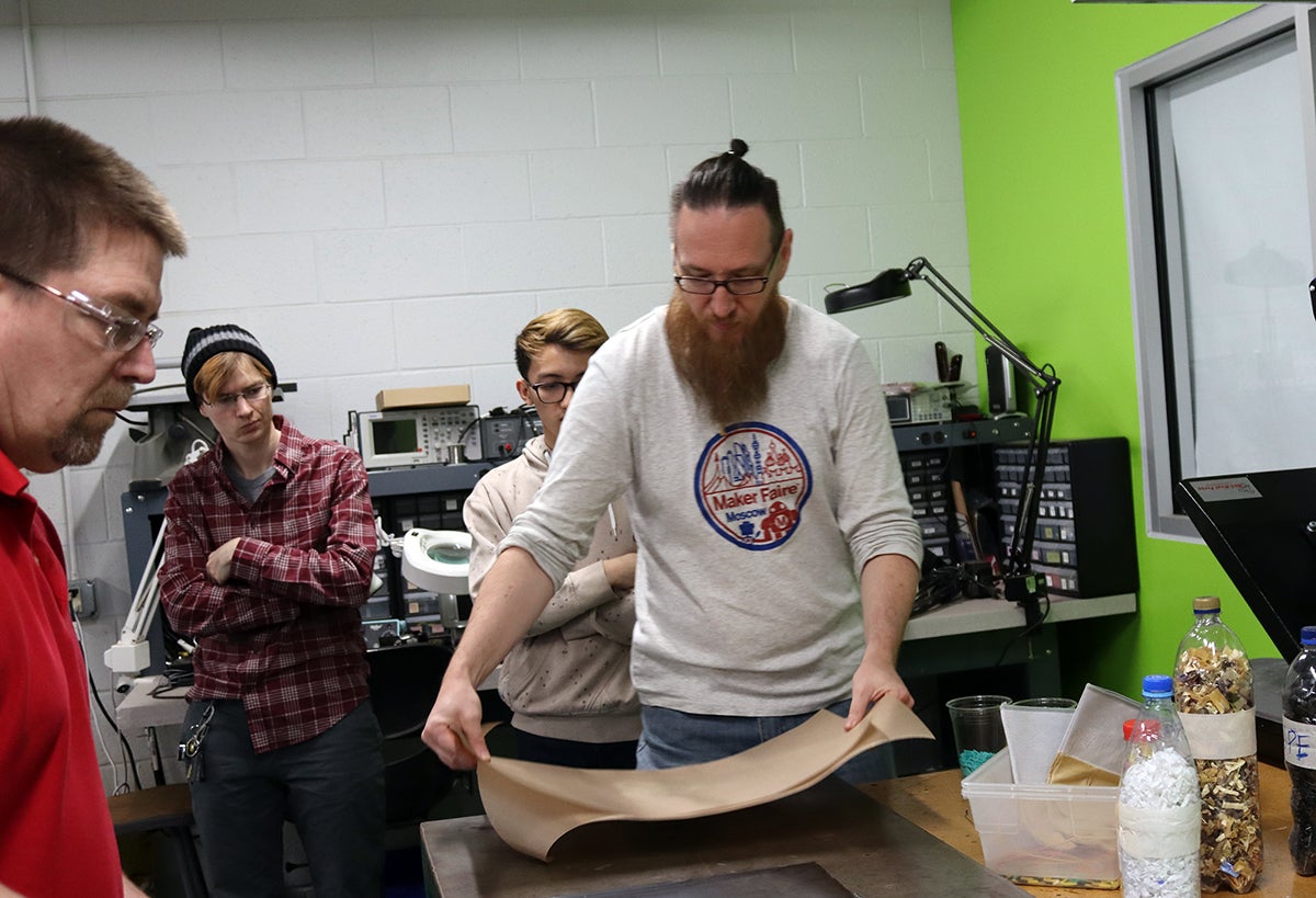 Vladimir Kuznetsov, founder of the fab lab Moscow, demonstrates how to recycle plastics into other objects in the UW-Stout Discovery Center Fab Lab.