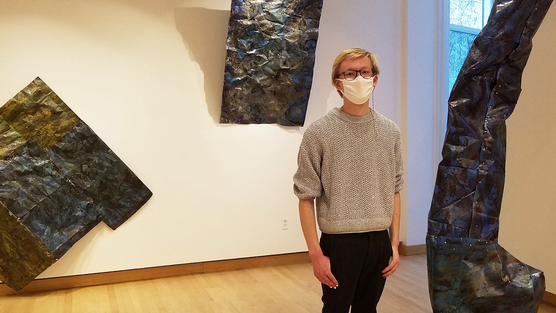 Studio arts senior and gallery assistant Beck Slack in Furlong Gallery.