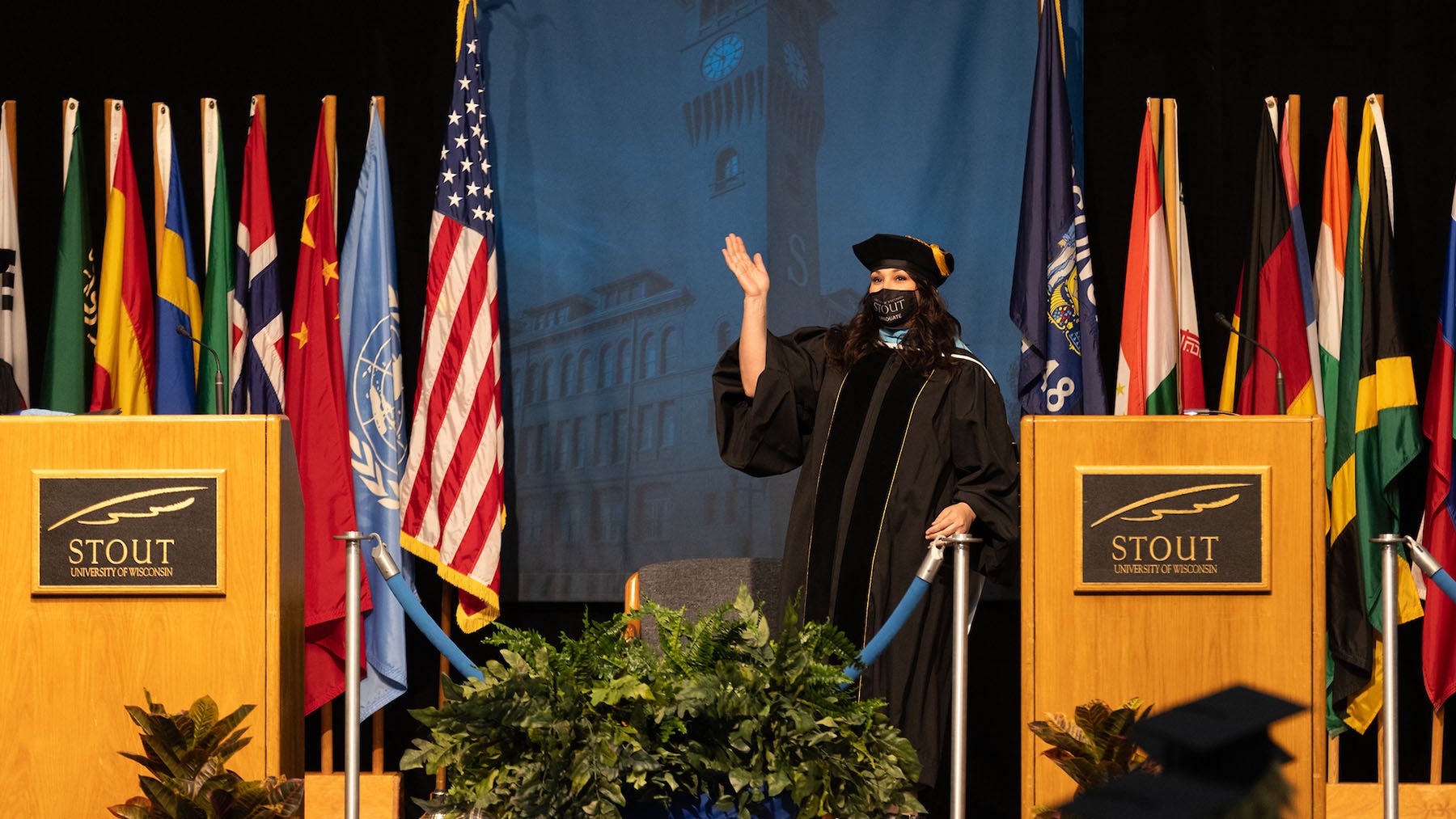 Rachel Krueger crosses the stage to receive her doctorate at the May 2021 commencement.