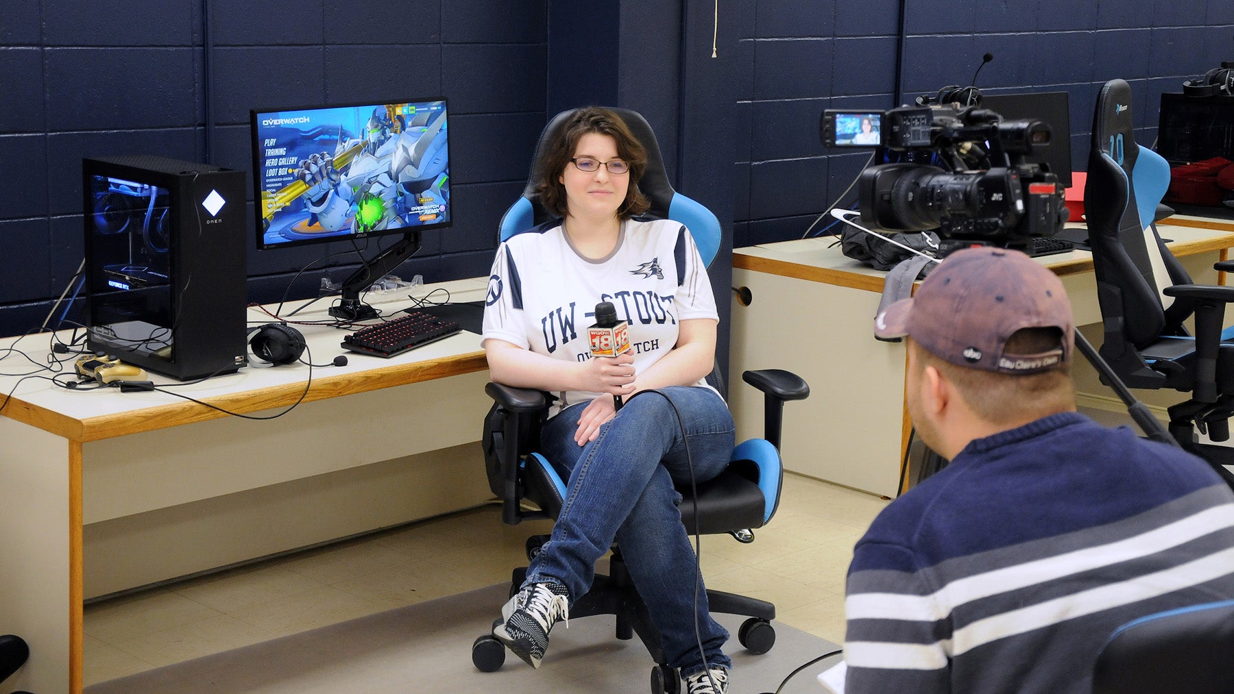 Esports athlete being interviewed by an esports production student as they prepare for live competition.