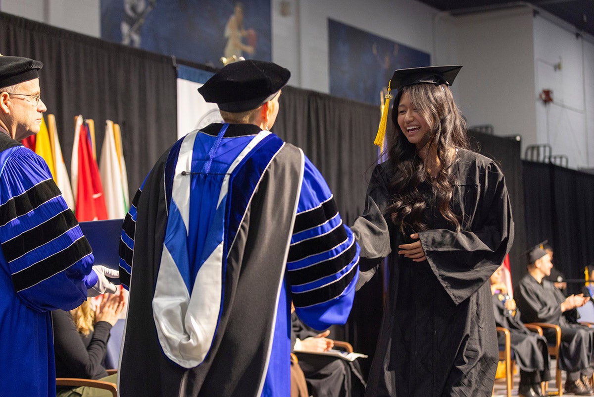 Woman accepting diploma