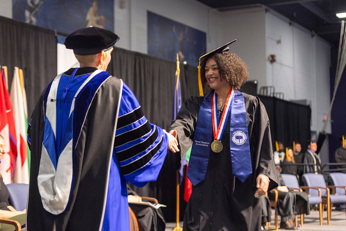 Woman receives college diploma