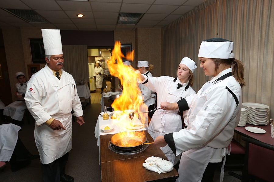 School of Hospitality students cooking. 