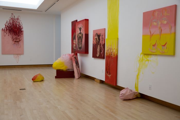 Various art pieces throughout a gallery room.