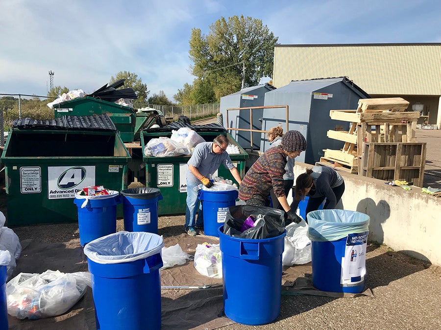 Members of the UW-Stout Waste Reduction Work Group conduct audits of recycling bins.