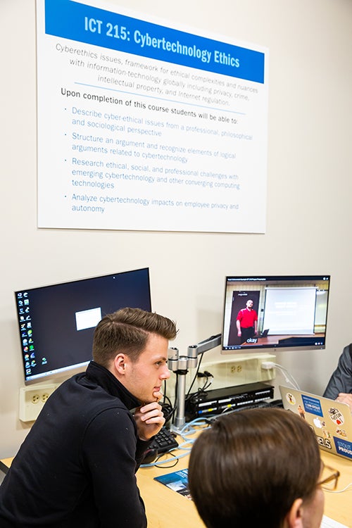 Ryan Moeller and other UW-Stout students check out a work station in one of the new computer networking labs.