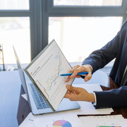 Hands holding an analytic report. 