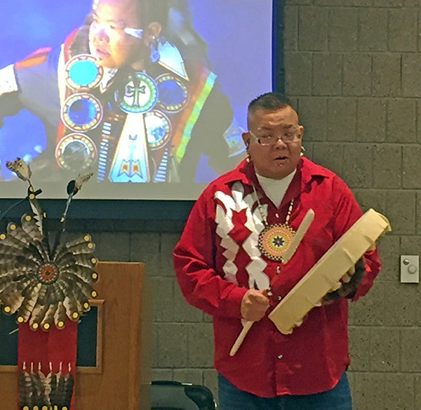 Playing a traditional drum, Prescott noted the beat is that of heartbeat, which is in all living creatures.