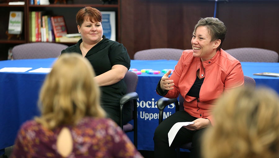​    ​Jill Chaffee, at right, vice president of adult services for LSS, talks with students as part of Employer in Residence, along with Shamara Lockwood, a senior recruiter for LSS.