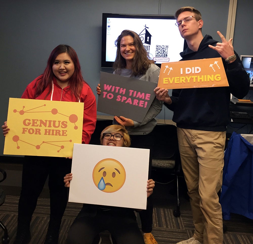 After the team escaped from room they posed for a picture to celebrate their accomplishment. From left to right standing are Chia Lor, Nicole Juza, Sam Giesregen and in front is Theresa Hang.