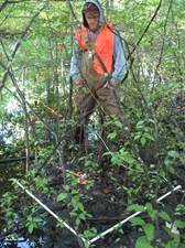 Student determines the plants within a plant survey plot