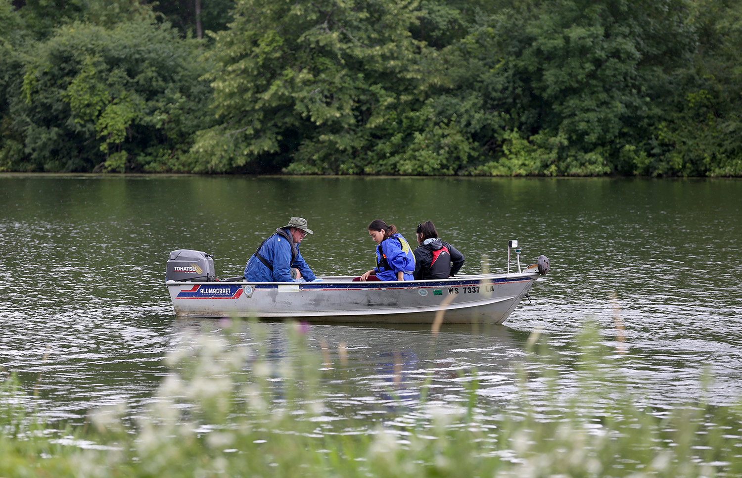 LAKES REU students collect water samples and check monitoring stations on Lake Menomin Tuesday, July 18, 2017. Thirteen university students from around the U.S. are part of LAKES REU, an 8-week summer research experience for undergraduates that studies issues related to blue-green algae in the Red Cedar River watershed and how the compromised water quality affects quality of life in the region. (UW-Stout Photo by Brett T. Roseman)
