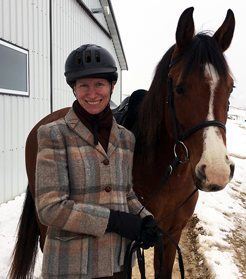 UW-Stout department of English and philosophy lecturer Monica Berrier with her dressage horse, Bishop. Berrier is the honorary scholar for the 2018 Menomonie Reads.