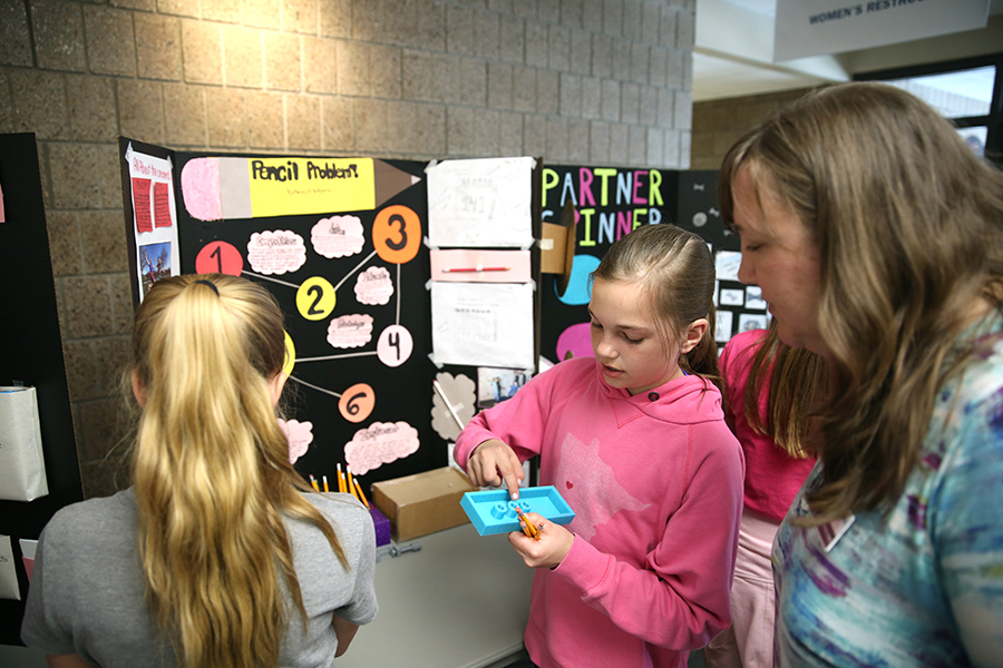 An Oaklawn Elementary School student explains research into the use of pencils during the UW-Stout Research Day, designed to give the elementary students an opportunity to experience sharing their research and answering questions.