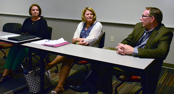 From left to right, retired Menomonie schools Superintendent Chris Stratton; Lisa Maas, vice president of human resources at Northeast  Wisconsin Technical College, Green Bay; and Timm Boettcher, president and chief executive officer at Realityworks, Eau Claire, take part in a panel discussion at the CTE Summit at UW-Stout.