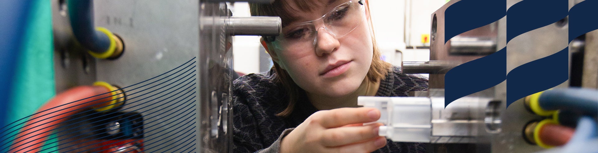 Student performs hands-on application in plastics engineering lab.