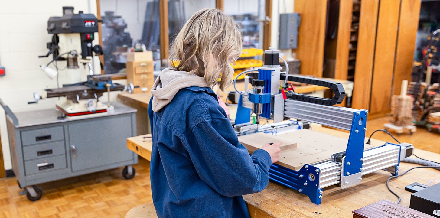 Student uses router equipment in the lab