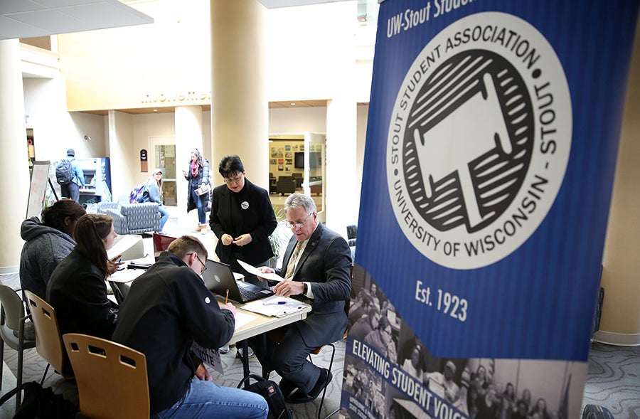 Stout Student Association members, joined by Chancellor Bob Meyer, hold a Rock the Vote registration event at the Memorial Student Center.