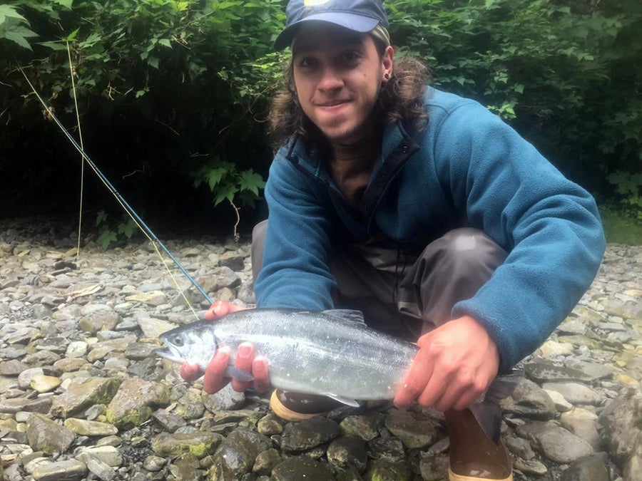 Walloch, pictured with a sockeye salmon, said the study abroad program helped him learn about different people and different ways of life.