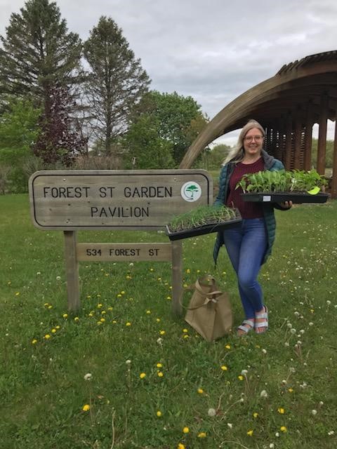 UW-Stout recent graduate Alyssa Weber with plants donated from the UW-Sprout Campus Garden to the Forest Street Community Garden in Eau Claire.