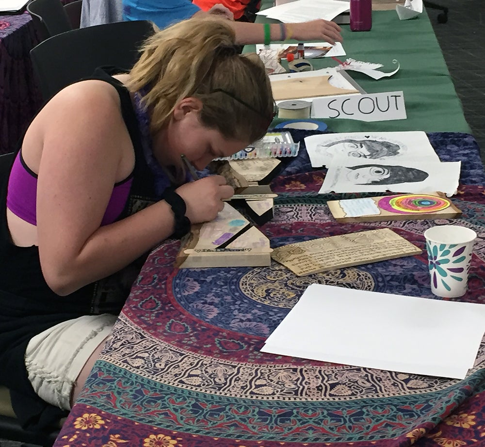 Rachael May, of Menomonie, works on a project during the intercultural leadership portion of the Summer STEAM Experience. May says she attended the conference to help to learn how to stop bullies.