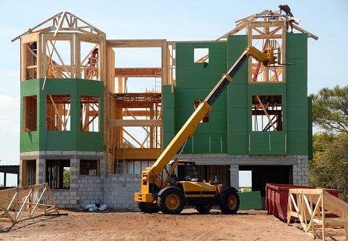 Photo of a house in the middle of construction