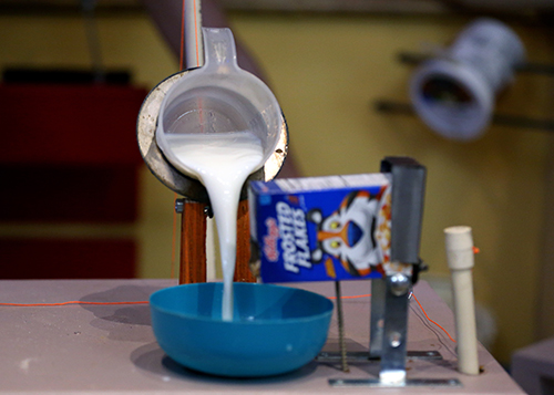The Thorp High School machine pours milk into a bowl of cereal at the Rube Goldberg competition as one of its steps.