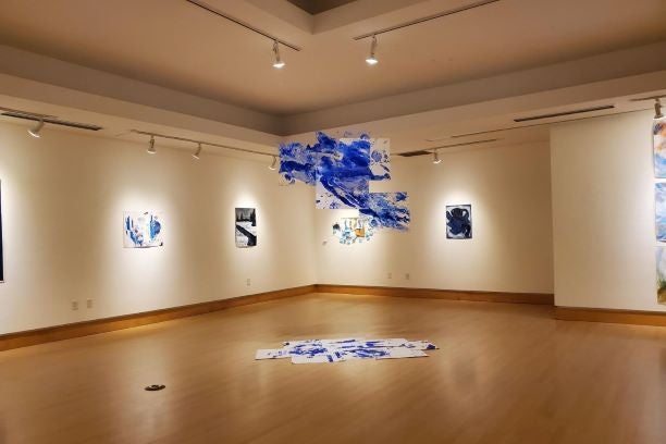 Two walls of various art pieces