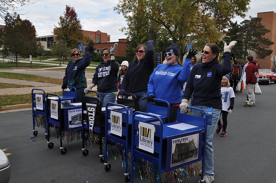 Vogl, at right, with the University Library drill cart team during Homecoming 2016.