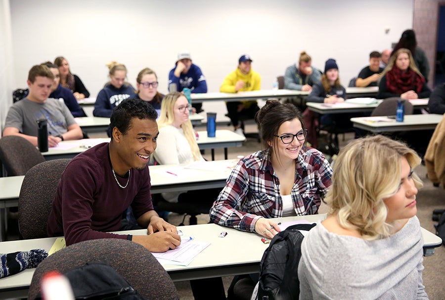 Clay Morgan, left, and Casey Mikl react to a comment in the class.