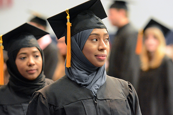 Fatimah, left, and Farah Alfayruz take part in their STEMM College commencement ceremony May 4.