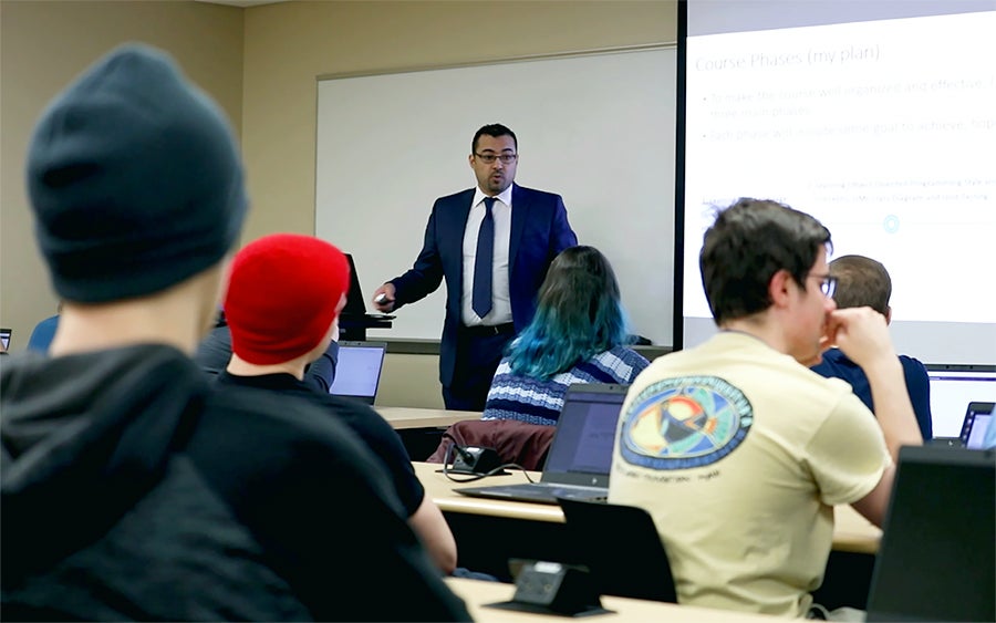 Saleh Alnaeli, who teaches computer science, lectures in a class at UW-Stout.