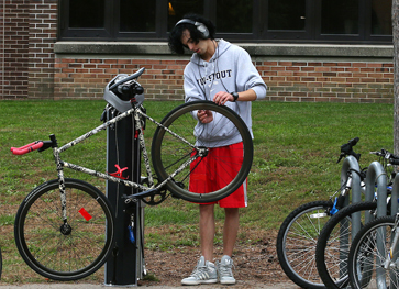 Photo of student at bike maintenance station