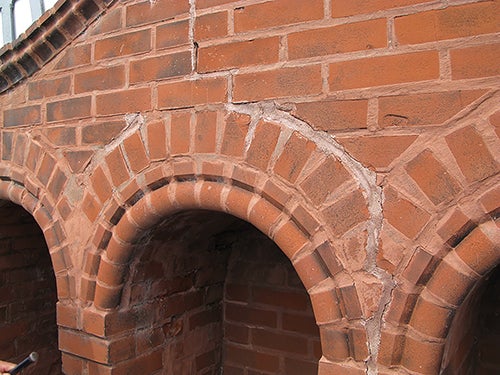 Brick and mortar damage on the tower can be seen near the clock.