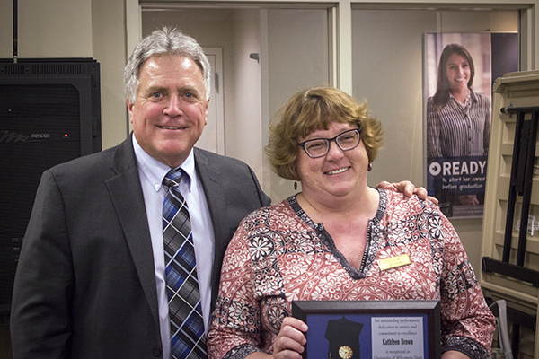 Kathleen Brown, who works in the Memorial Student Center, receives the University Staff Employee Appreciation Award for April from Chancellor Bob Meyer.