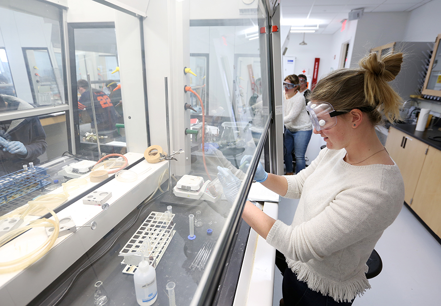 A student conducts research in an organic chemistry lab at UW-Stout.