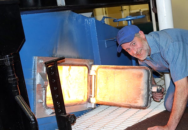 Heating Plant employee Brian Weisenbeck checks the furnace March 4, the last day coal was burned at UW-Stout.