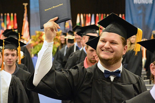 Students celebrate during commencement ceremonies Saturday, May 4.