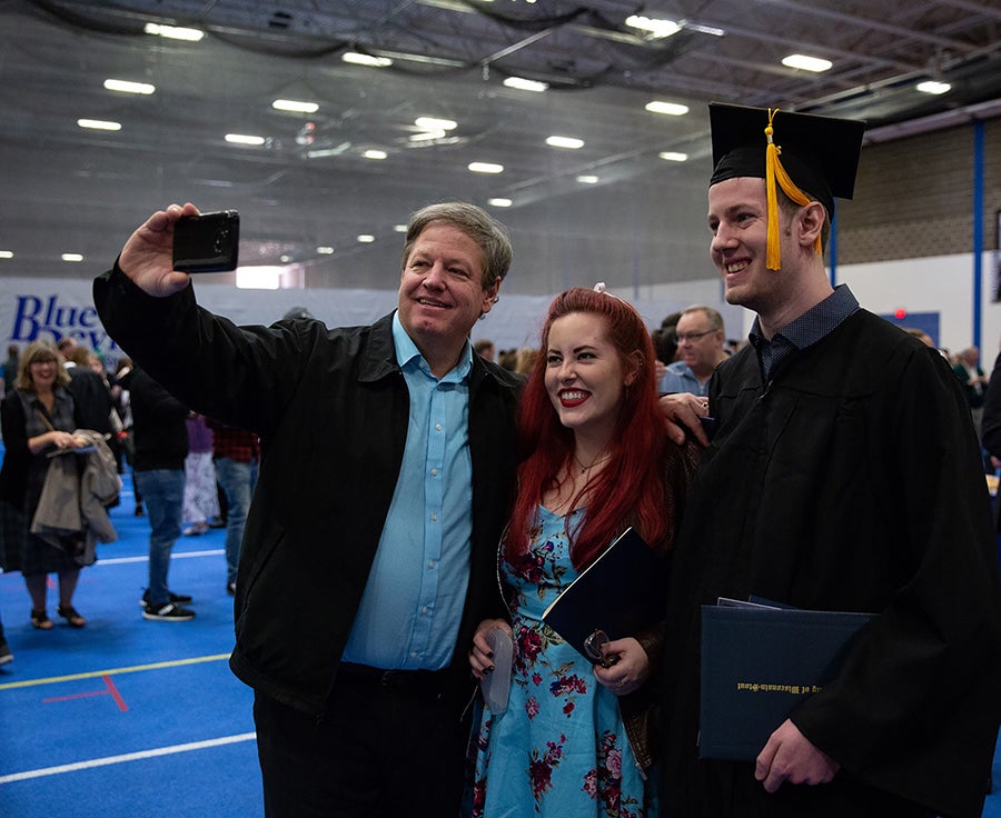 Students celebrate during commencement ceremonies Saturday, May 4.