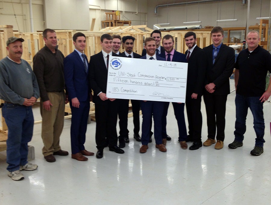 The Chippewa Valley Home Builders Association donated $1,500 to the UW-Stout construction team to help it compete in the national event. CVHBA members are, left Pat Smith, Eau Claire Insulation and Exteriors; second from left, CVHBA President Paul Holzinger, Holzinger Homes; and right, Adam Ashley, Ashley Construction.